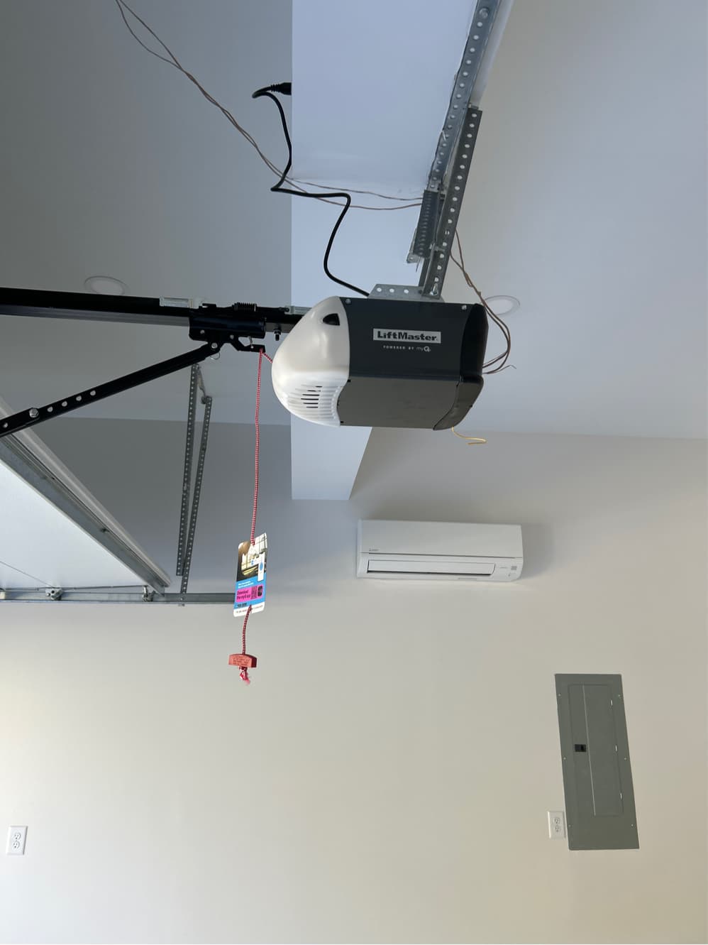 LiftMaster myQ smart garage door opener installed on ceiling rail in residential garage