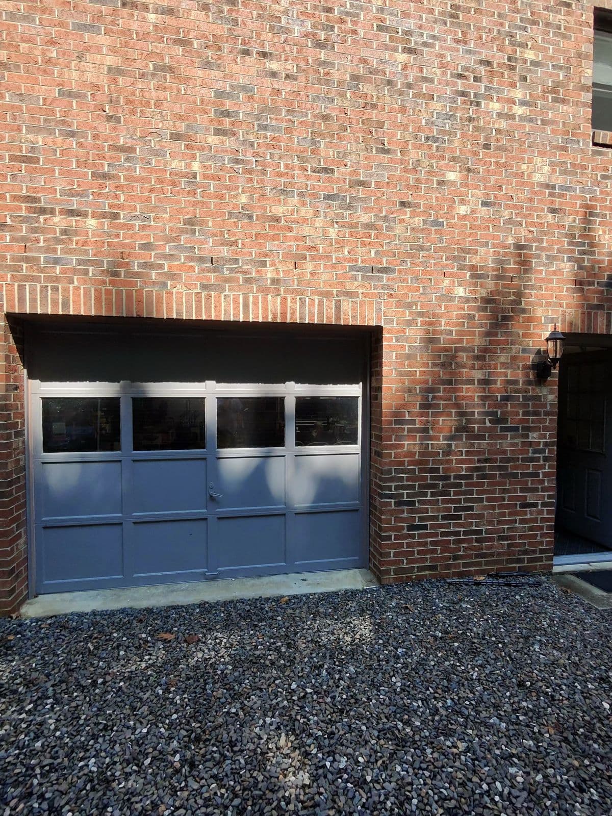 New black door on brick home in Thomasville NC
