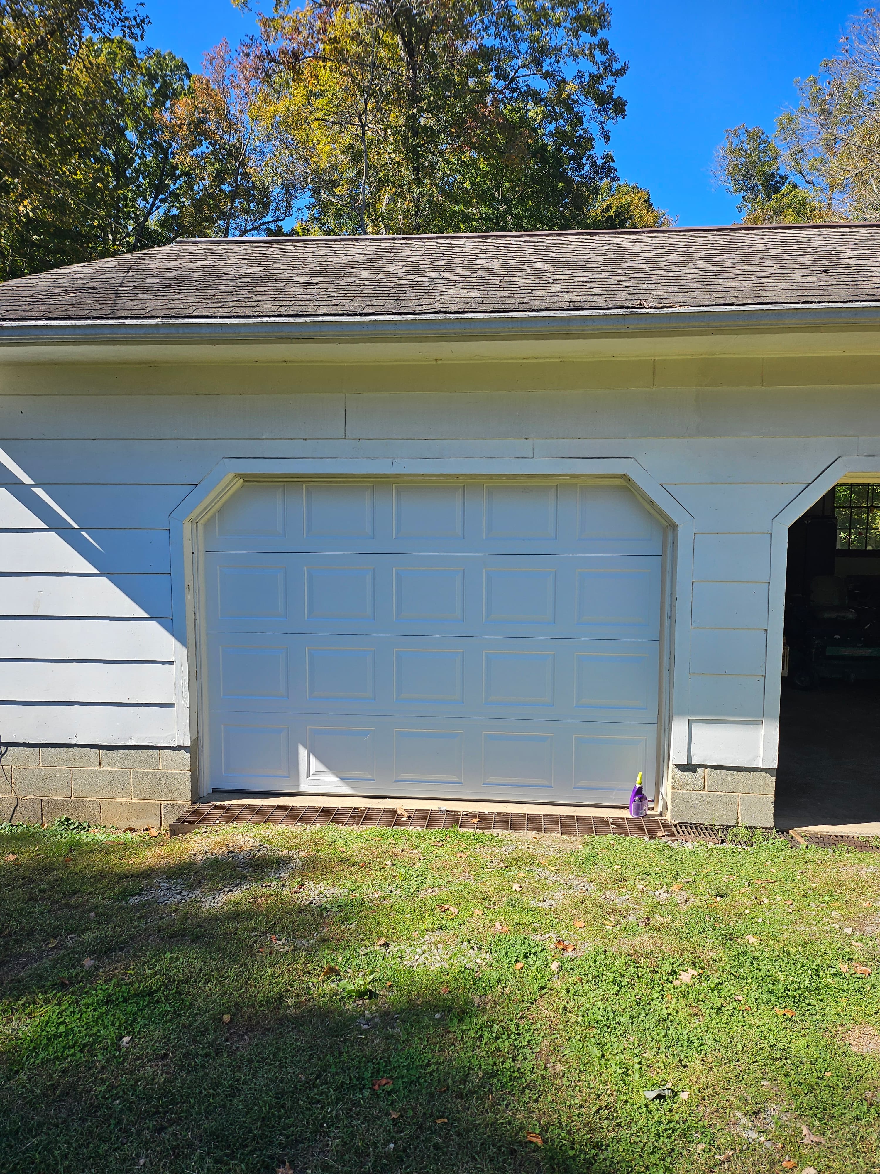 New single-car garage door after replacement in Piedmont Triad NC
