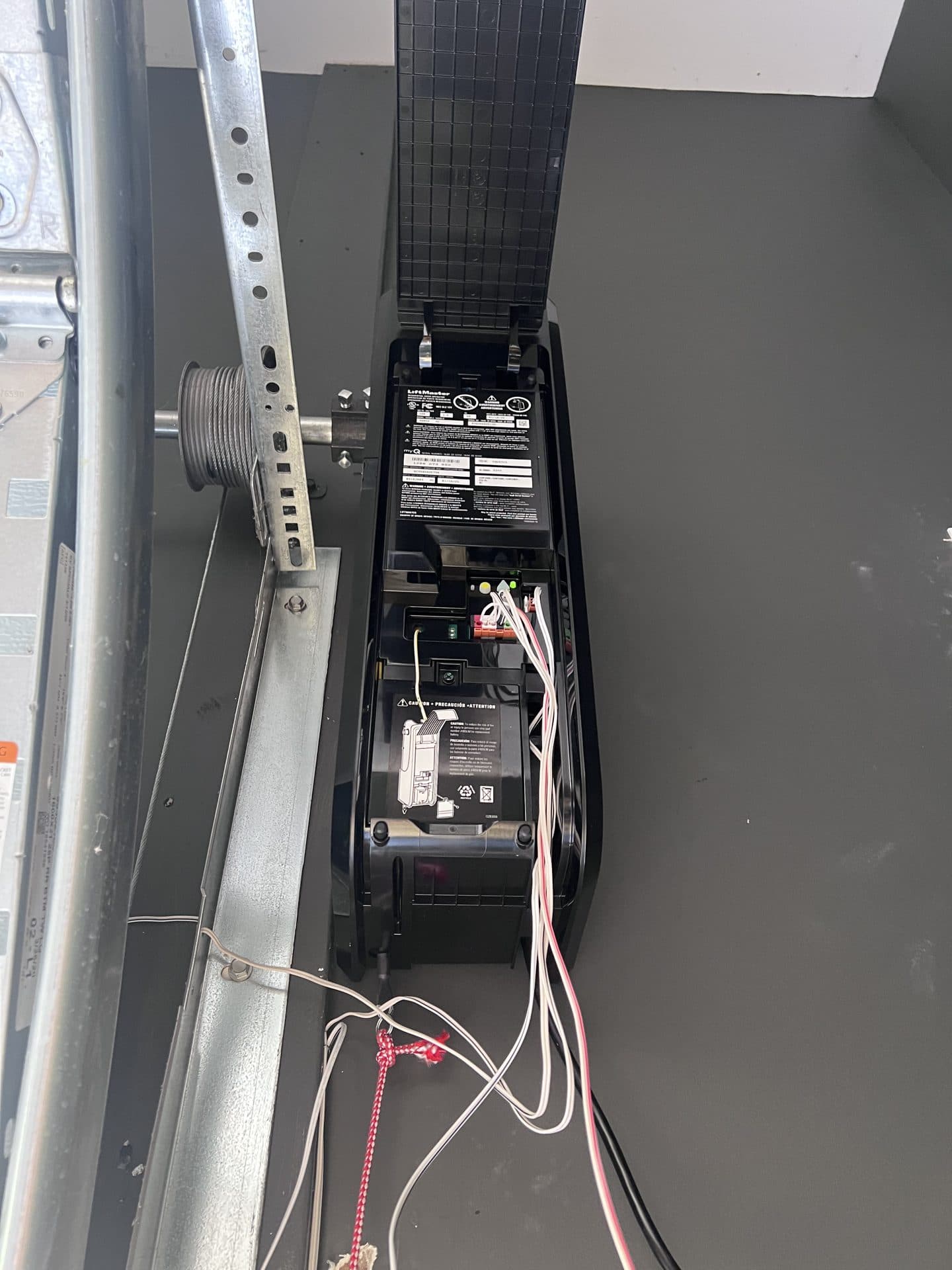 LiftMaster jackshaft wall-mount opener motor and cable drum detail