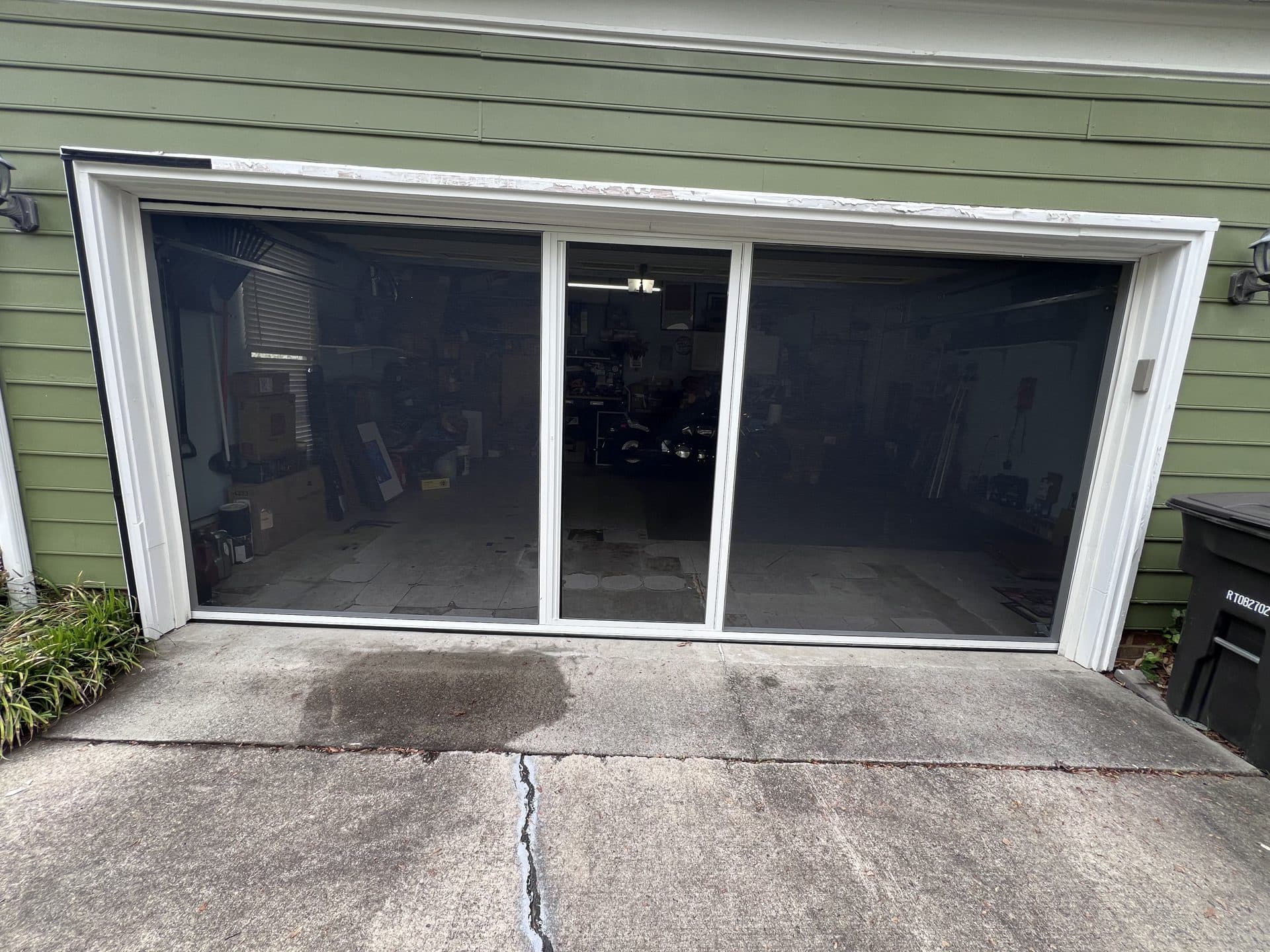 Retractable garage screen door installed on green house in High Point NC