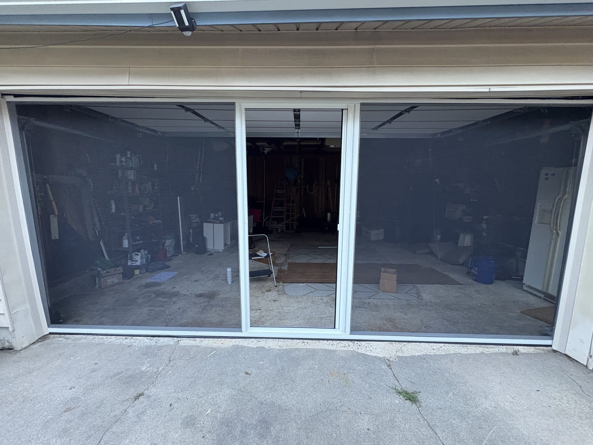 Completed retractable screen on beige house