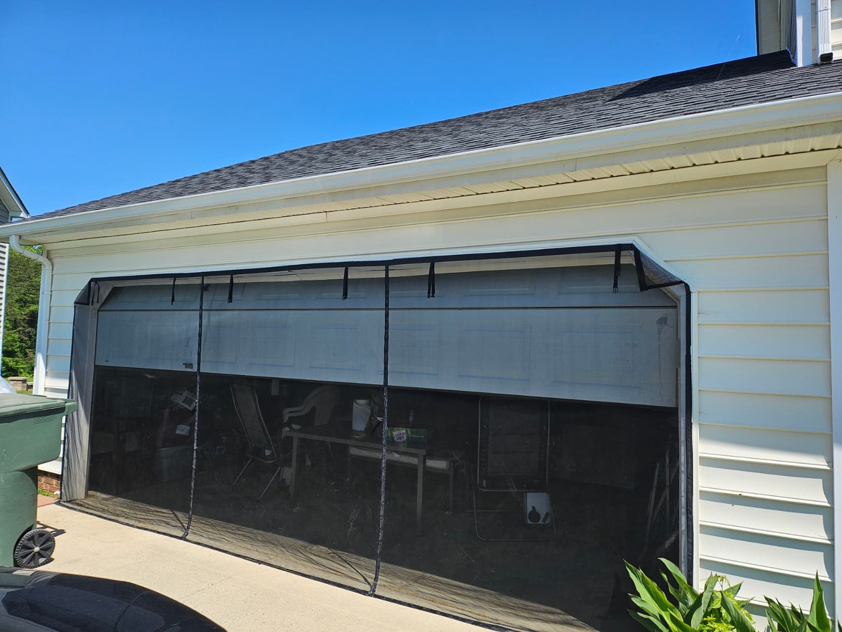 Retractable mesh garage screen door