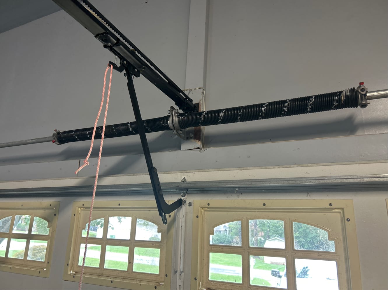 New torsion springs properly installed on header with center plate and opener rail NC