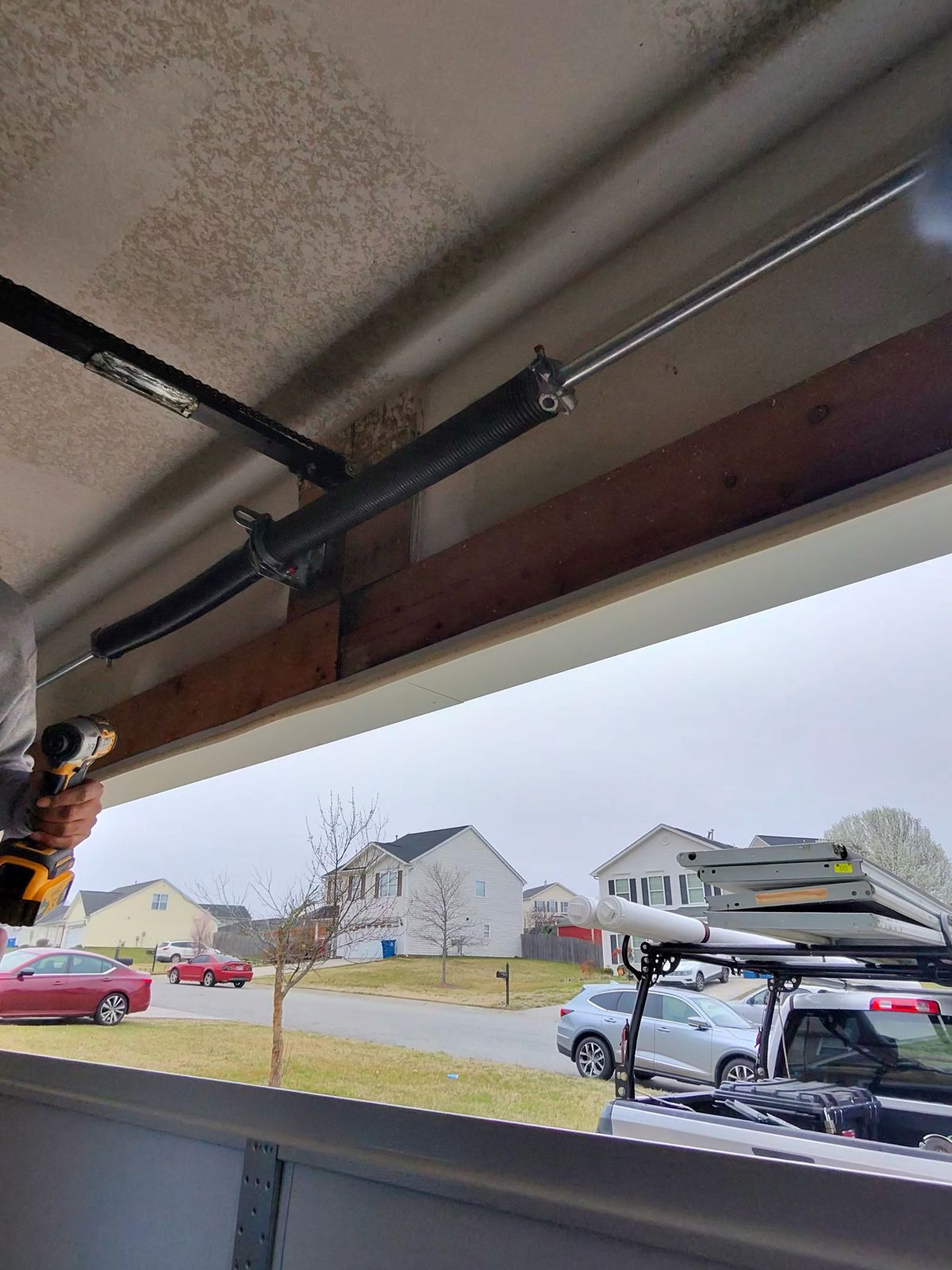 Torsion spring repair in progress with TNGD service truck in Piedmont Triad NC